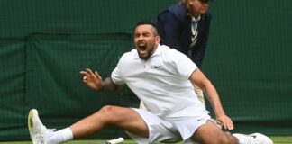 Wimbledon defends turf, players continue to slip